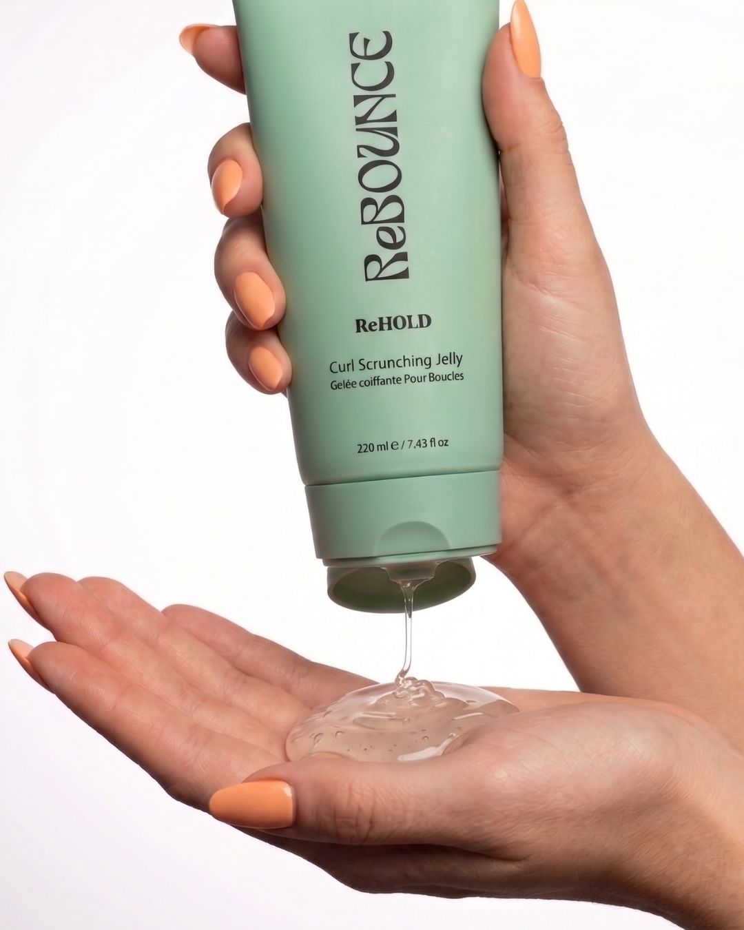 Hand holding a green bottle labeled 'Rebounce' with jelly being dispensed onto the palm.