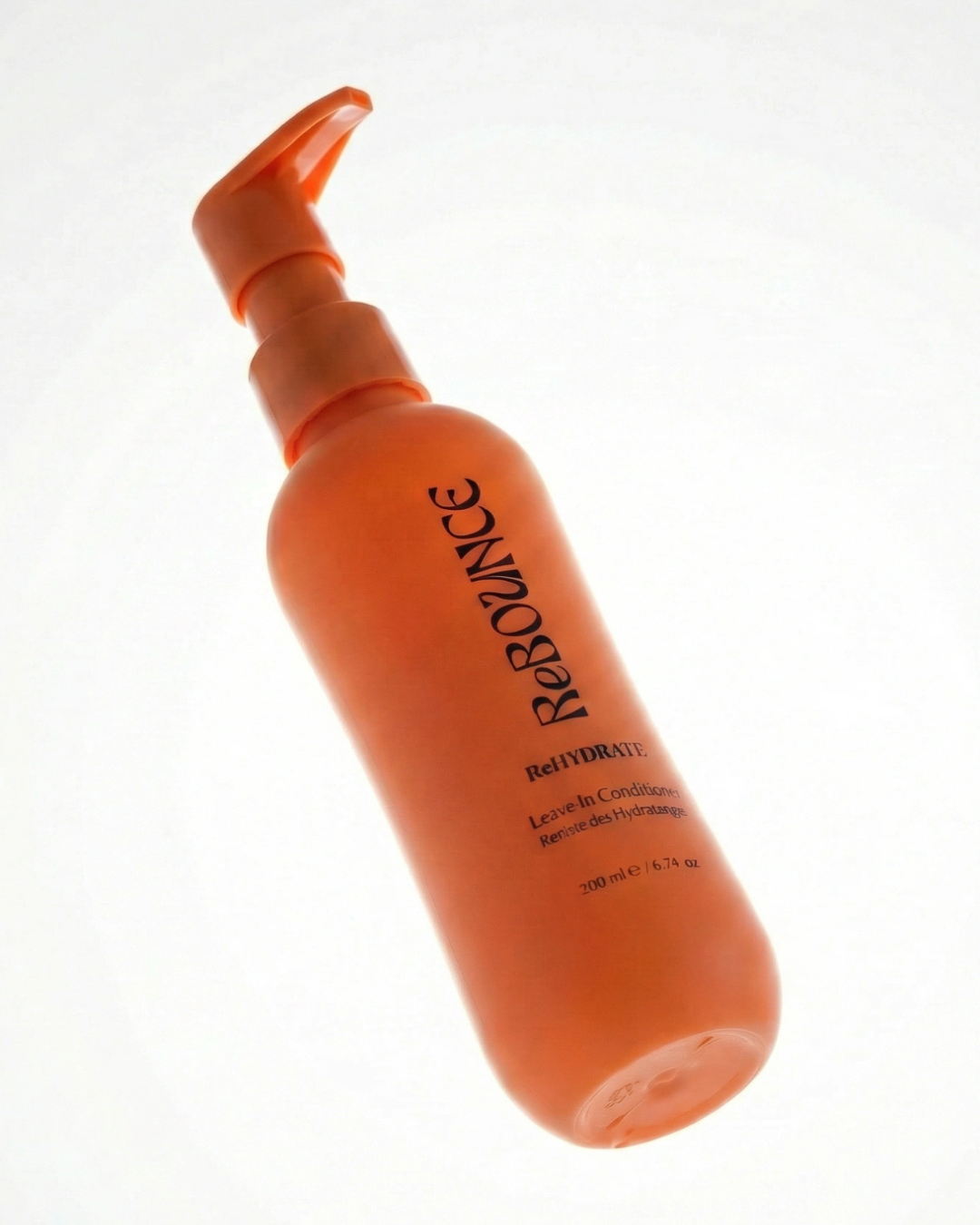 Orange bottle of Rebounce leave-in conditioner on a white background