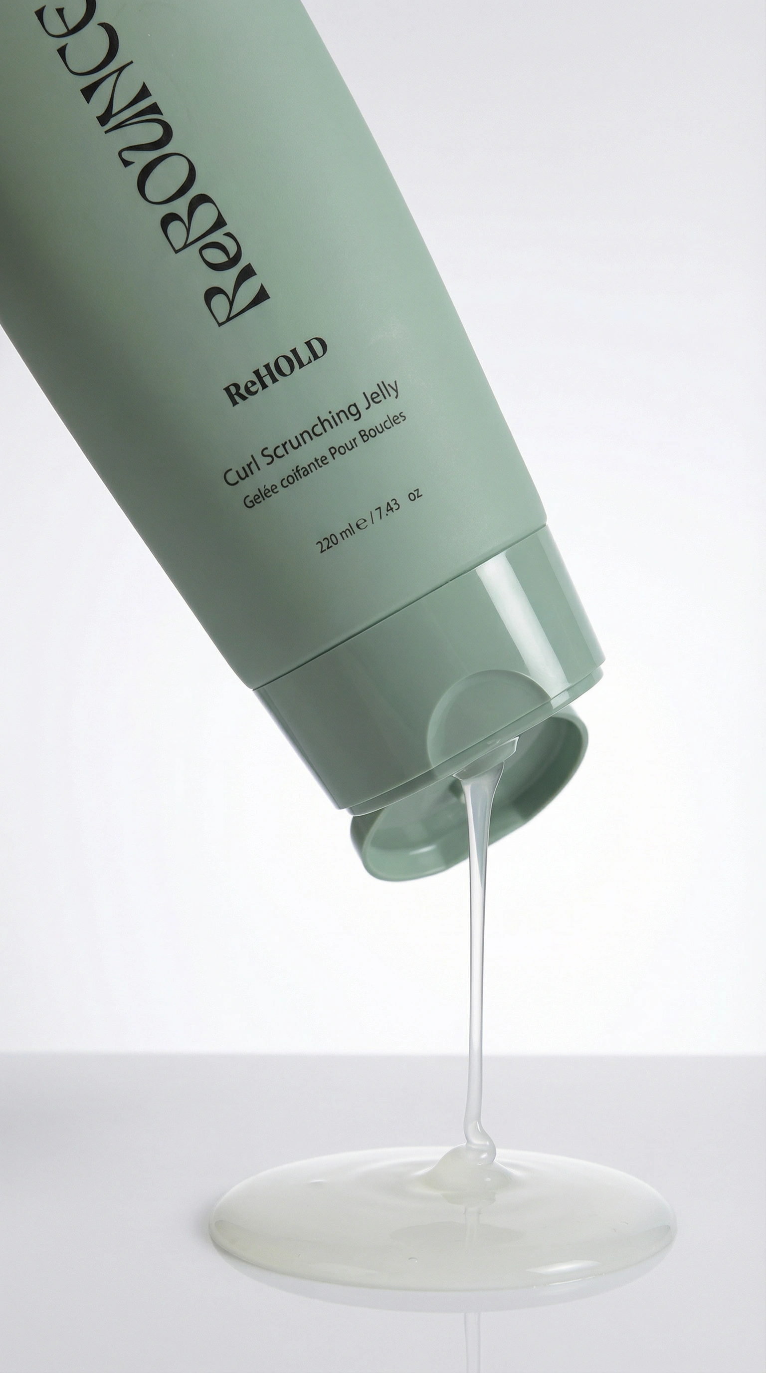 ReHOLD curl scrunching jelly hair product with jelly being poured onto a white surface